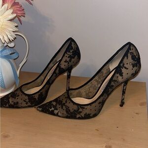 Black lace Jimmy Choo London heels.